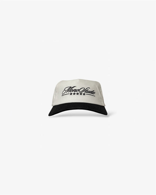 Two-tone cap with black visor and white top on a white background